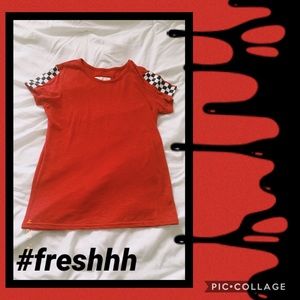 Red T shirt with checkered pattern on the sleeves